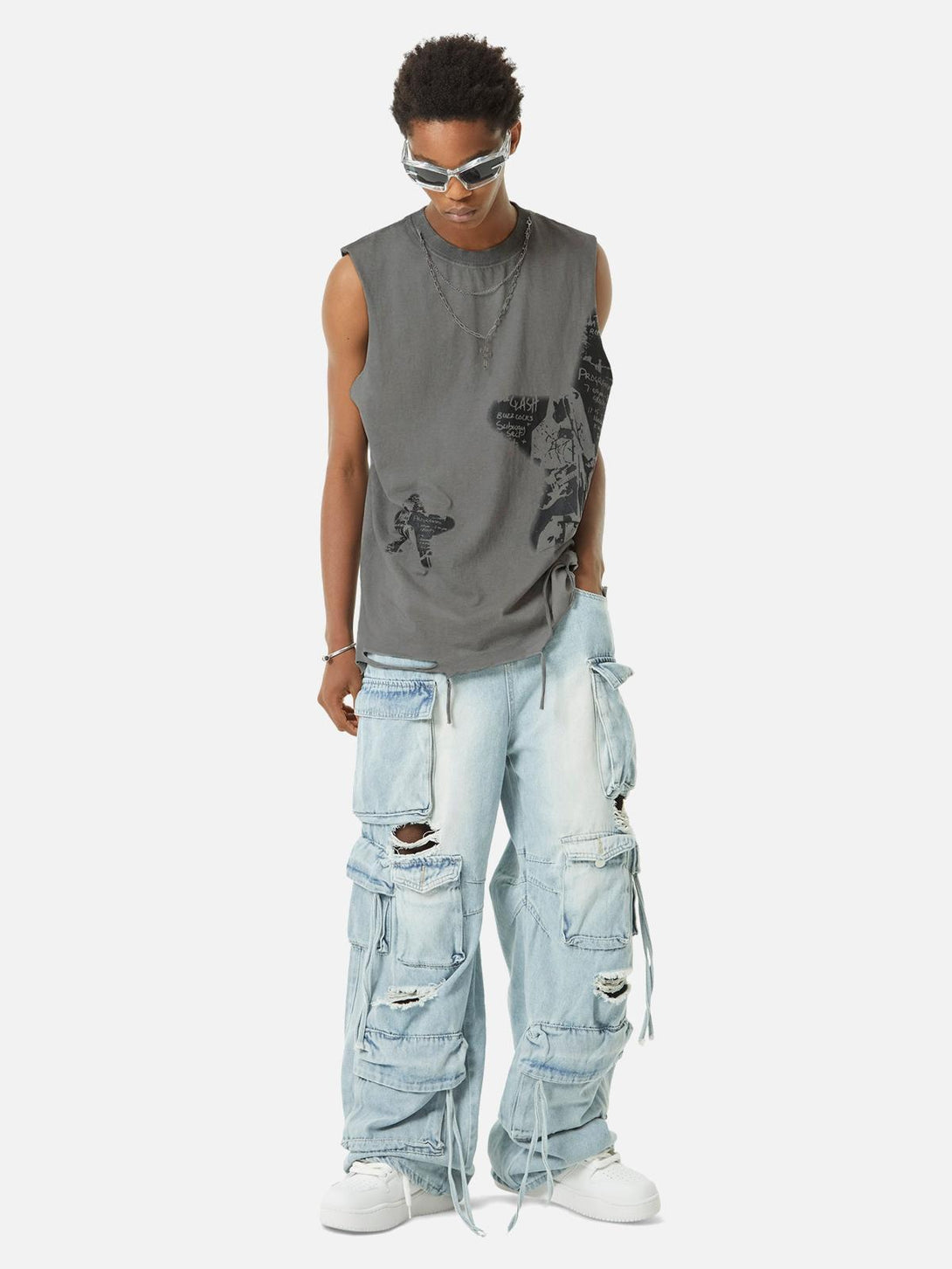 Model wearing TALISHKO hip-hop tank top with star print, paired with distressed denim.