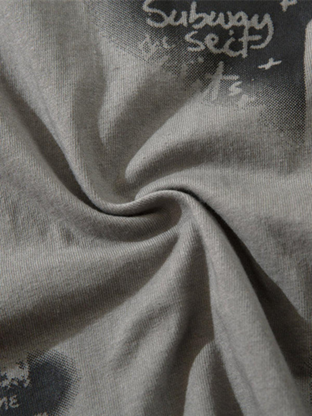 Focusing on the texture and print detail of TALISHKO's hip-hop tank top fabric.