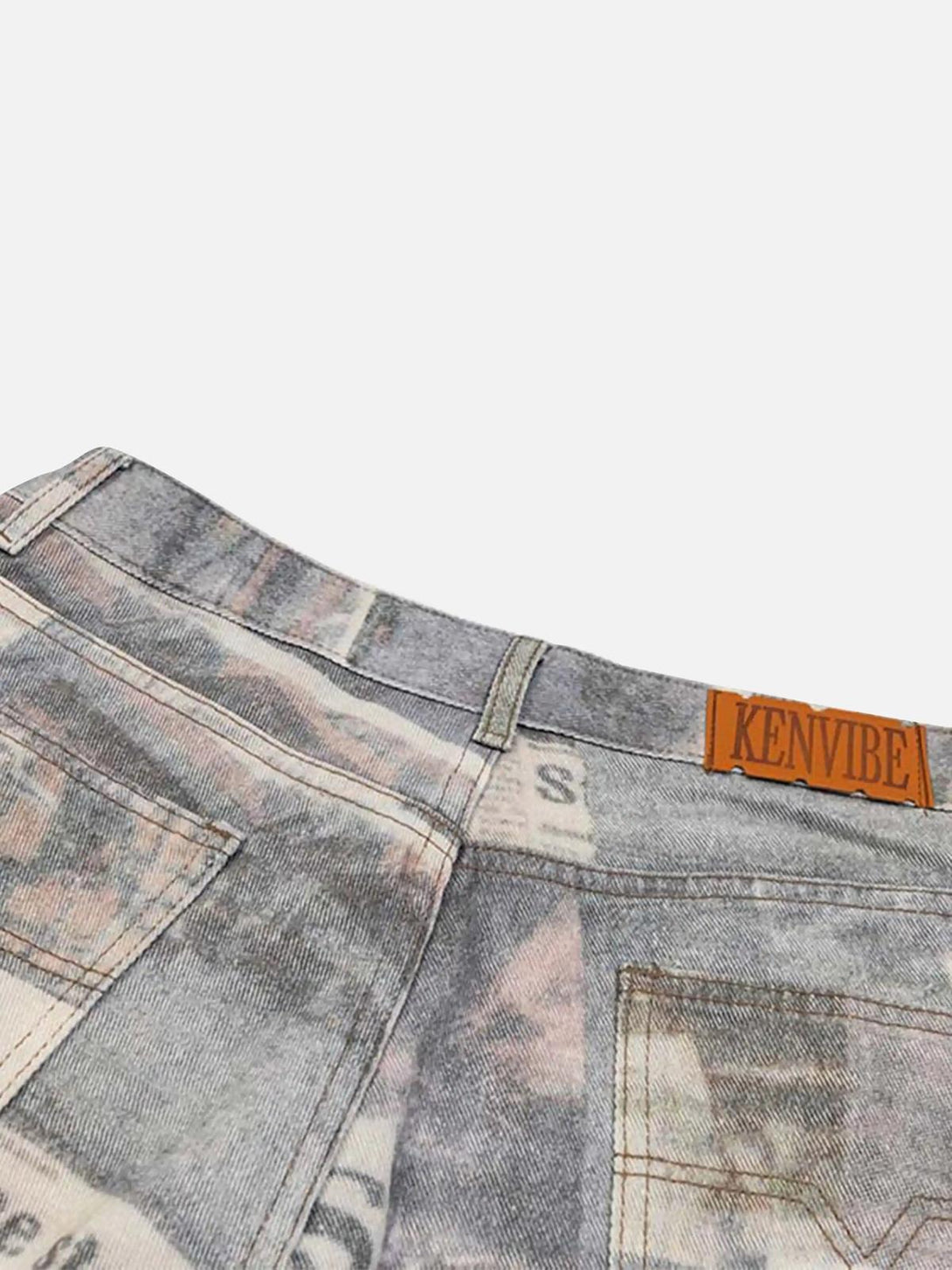 Detailed fabric and stitching of TALISHKO's vintage newspaper print pants, highlighting unique design.