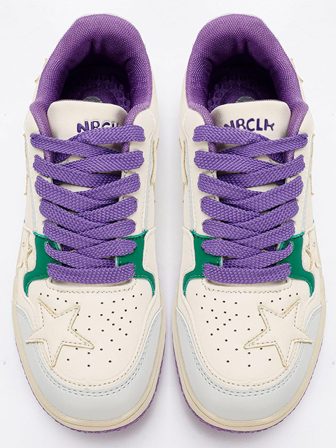 Top view of TALISHKO sneakers showcasing purple laces and star accents for a bold style statement.