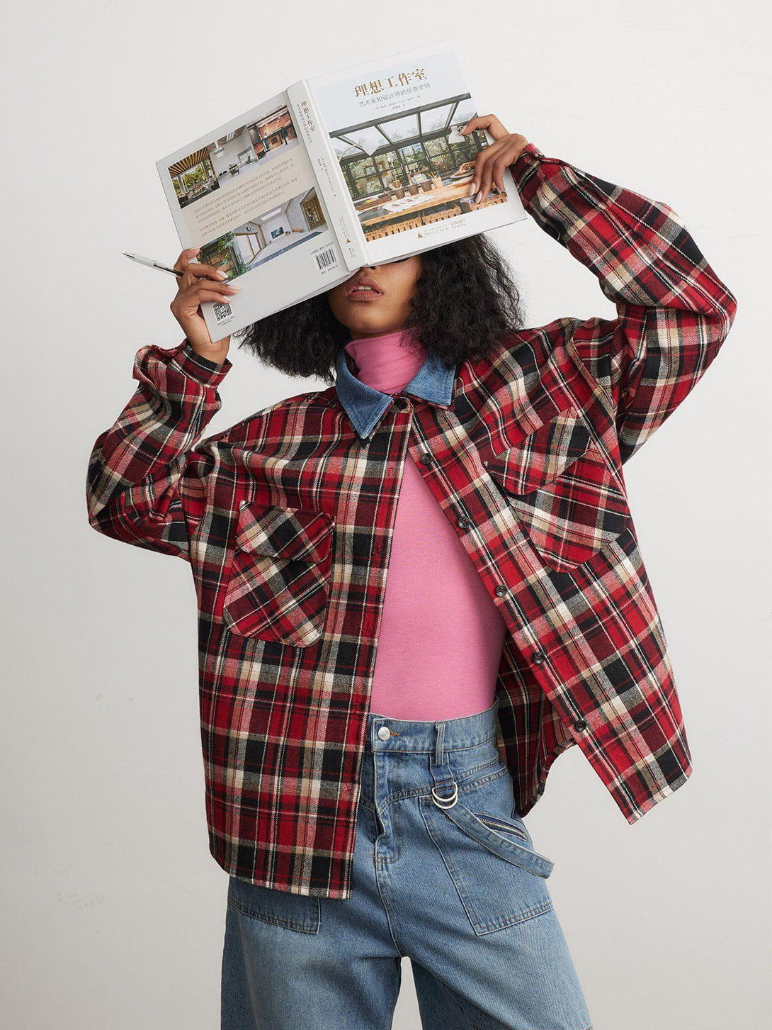 Model wearing a vintage plaid long-sleeved shirt by TALISHKO, styled with a pink turtleneck.