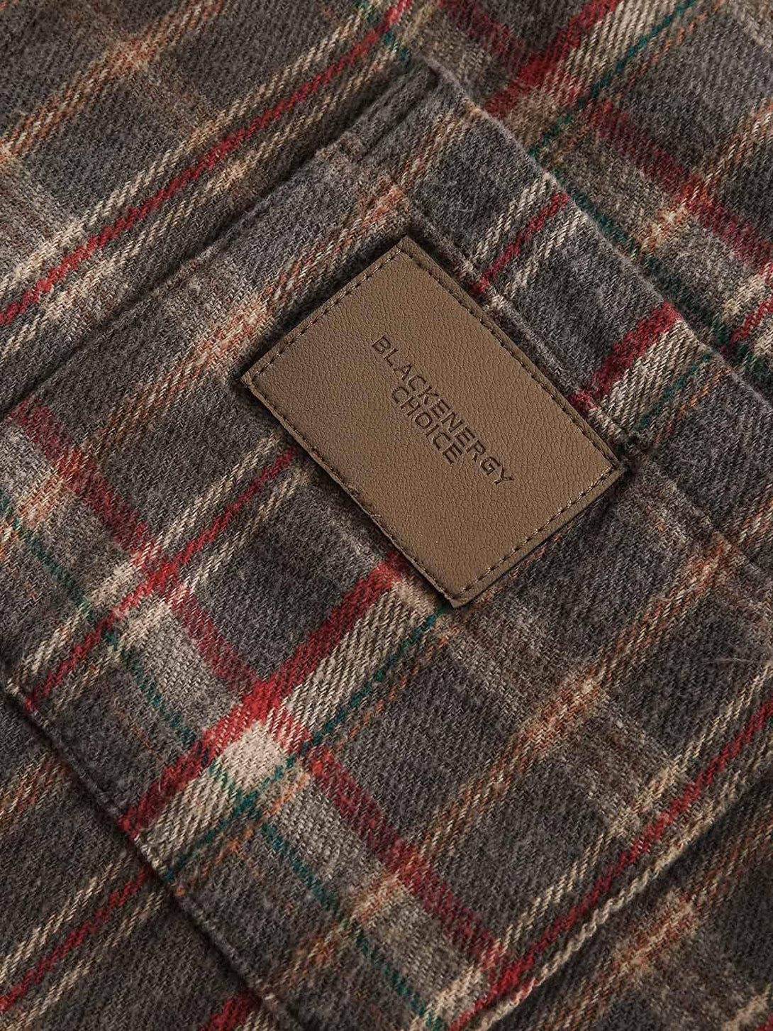 A close-up of the vintage plaid tie-dye fabric by TALISHKO, highlighting texture and detail.