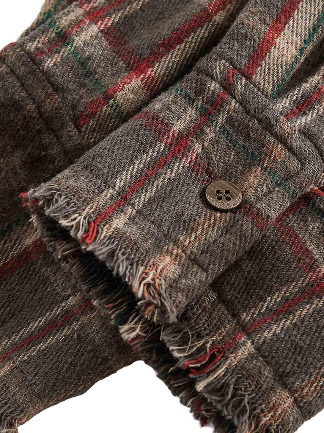 Intricate look at the vintage plaid tie-dye sleeve detail by TALISHKO, highlighting texture.