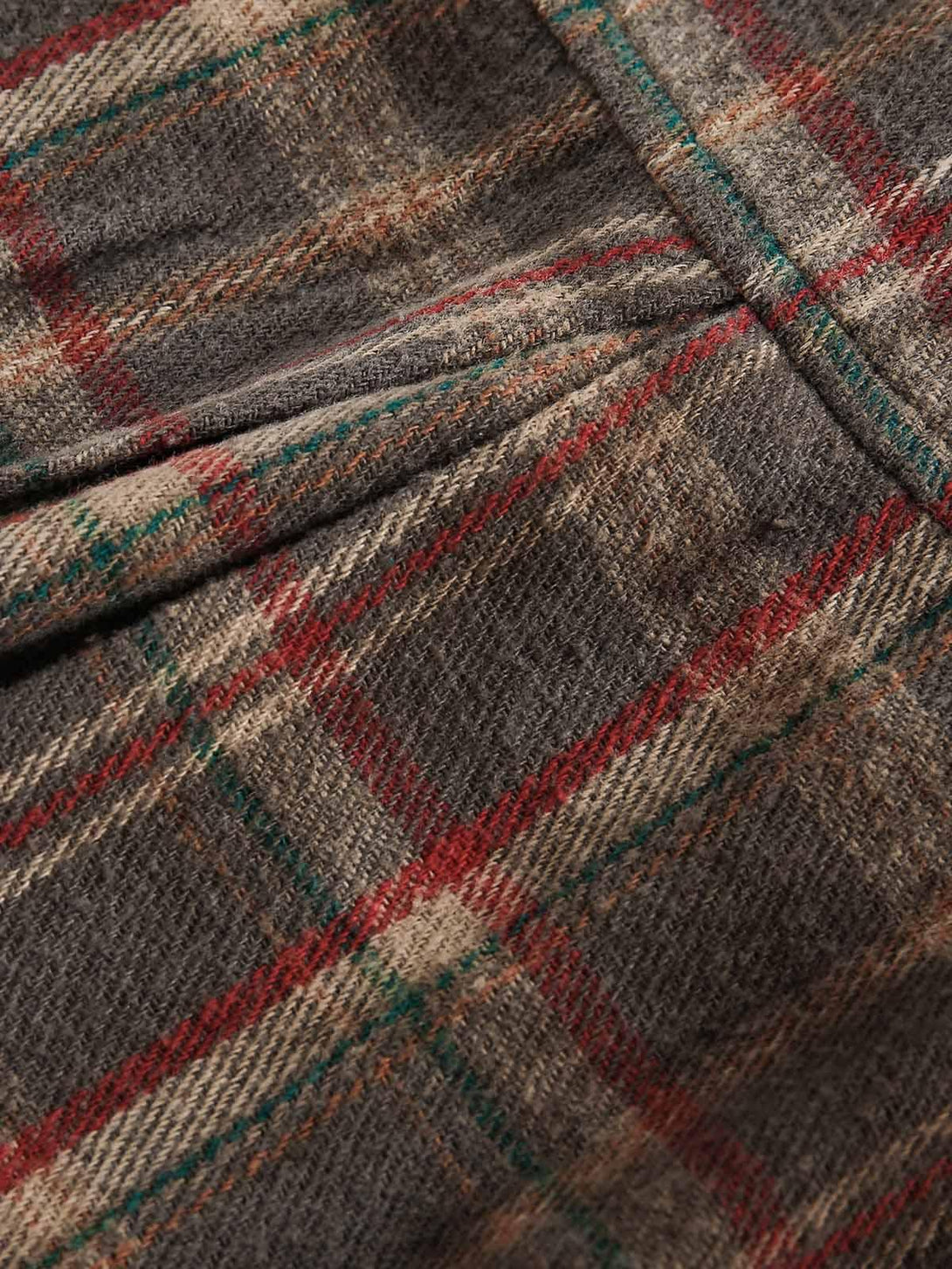 Texture and pattern showcased in the vintage plaid tie-dye fabric by TALISHKO, highlighting detail.