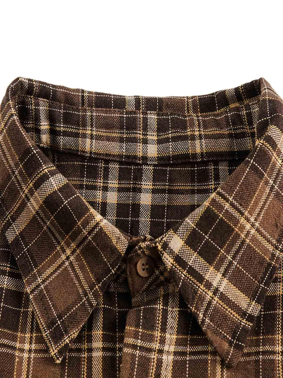 Intricate look at the brown plaid fabric of a TALISHKO shirt, highlighting its classic style.