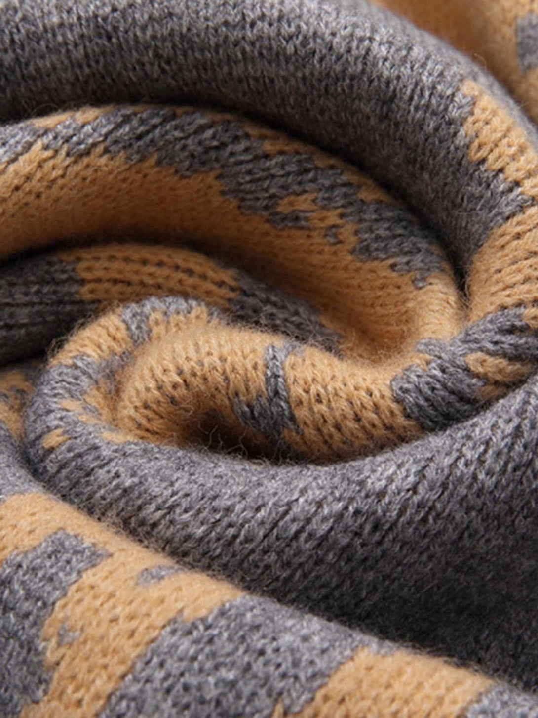 Focusing on the knit texture and pattern of a sweater by TALISHKO, highlighting vintage charm.