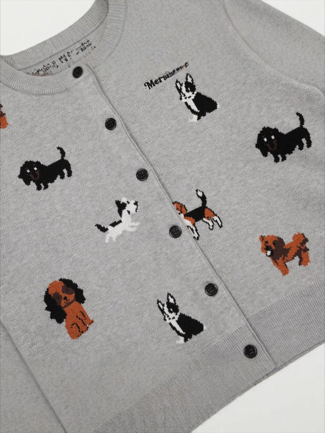 Charming knit cardigan by TALISHKO with playful puppy embroidery, ideal for cozy layering.
