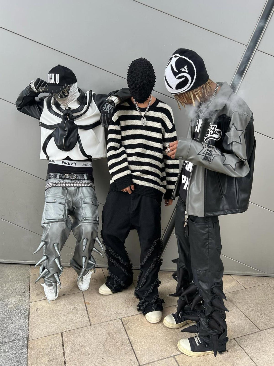 Streetwear style featuring TALISHKO's edgy flared jeans with bold textures and unique accessories.