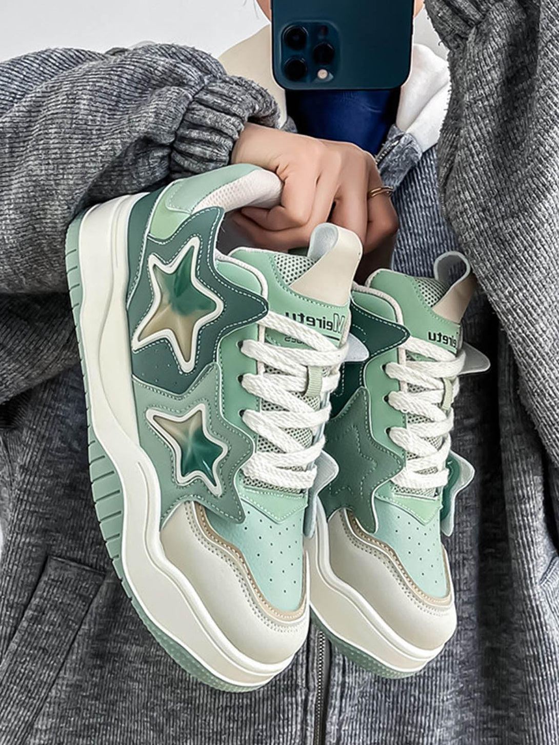 A closer look at green vintage star sneakers by TALISHKO, featuring a stylish retro design.