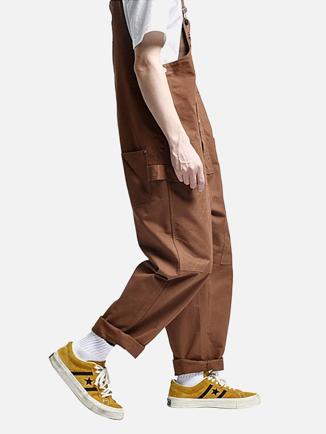 Model in TALISHKO vintage straight overalls, styled with white tee and yellow sneakers.