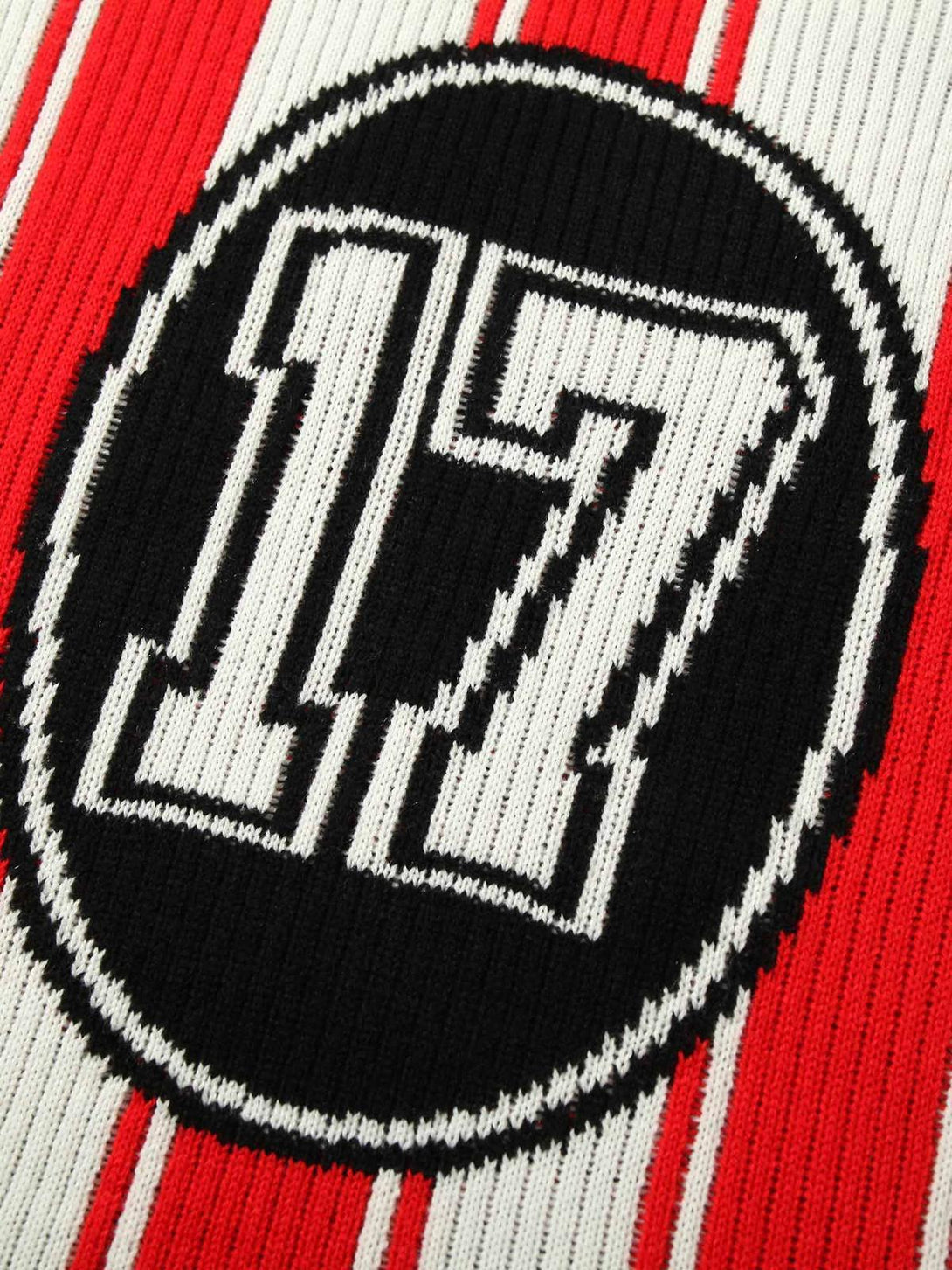 A close-up of the TALISHKO vintage striped knit sweater featuring the bold number 17 design.