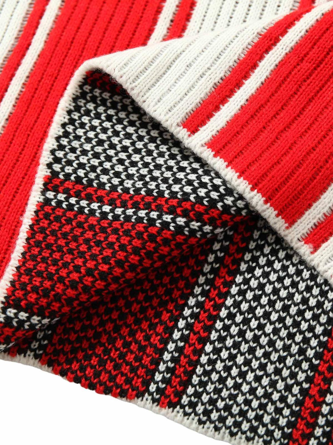 Detailed fabric and stitching on TALISHKO's vintage striped knit sweater, showcasing vibrant colors.