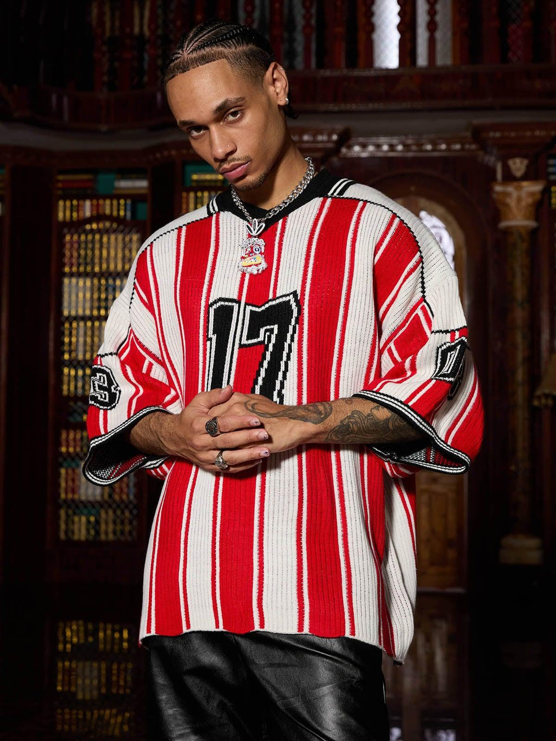 Model in TALISHKO vintage striped sweater, red and white, with bold numbers and sporty style.