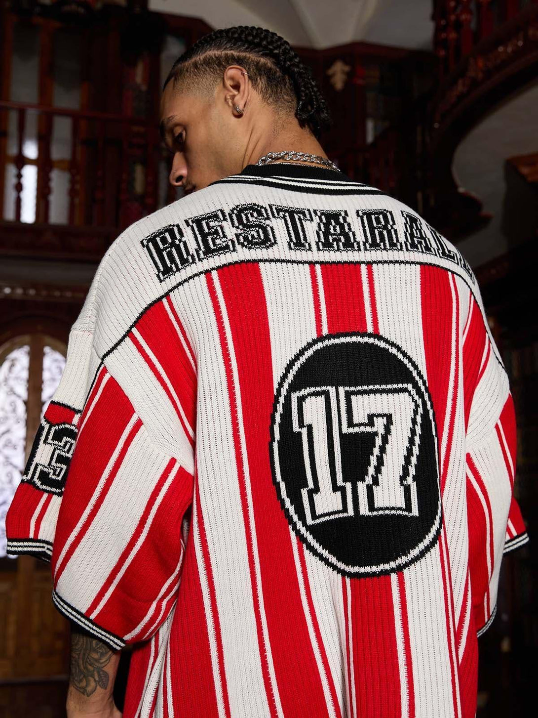 Back view of a TALISHKO vintage striped sweater, showcasing bold number detail and sporty style.