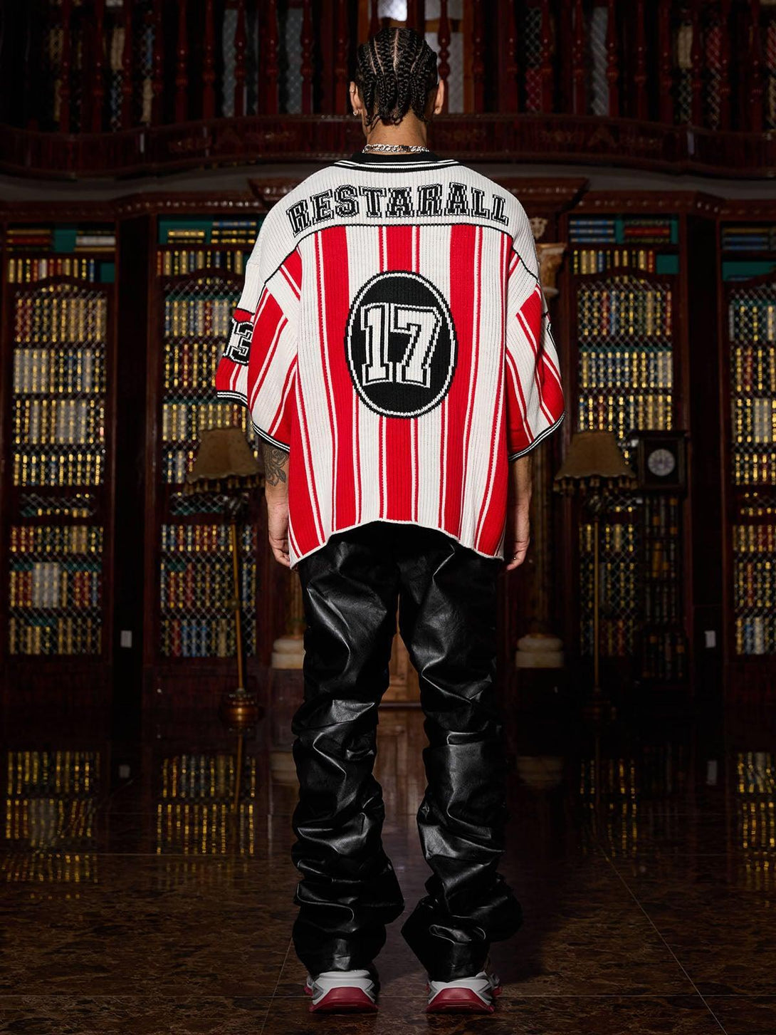 Back view of TALISHKO vintage striped sweater with bold number design and sporty flair.