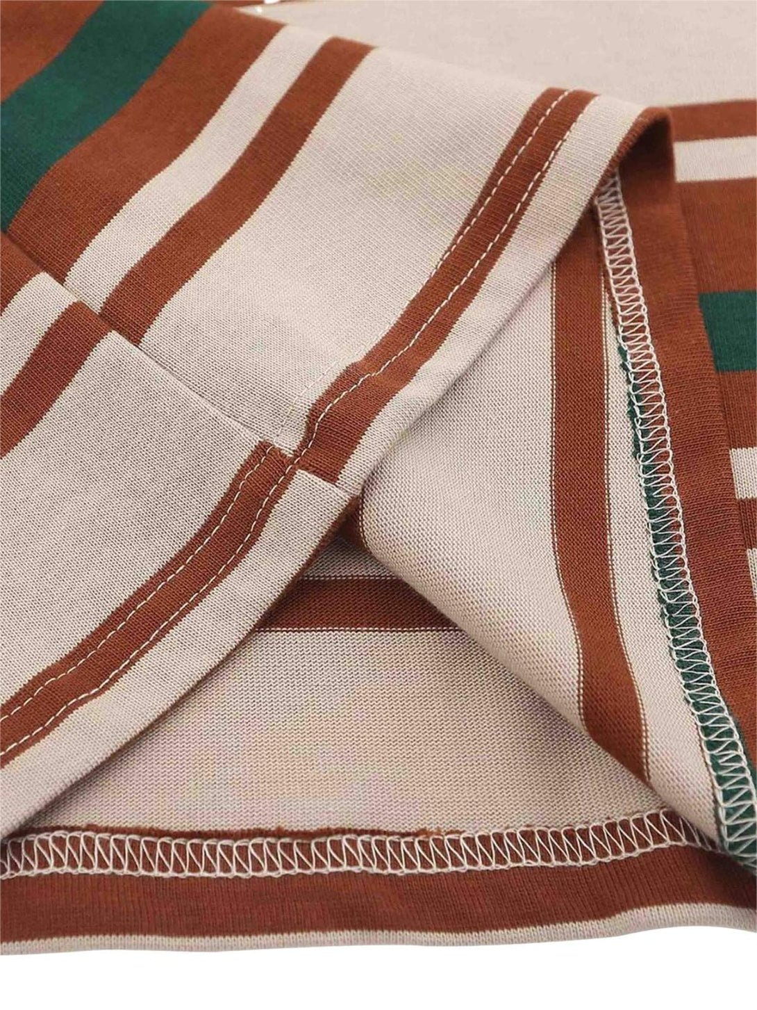 Detailed fabric and stitching of a vintage striped polo shirt by TALISHKO.