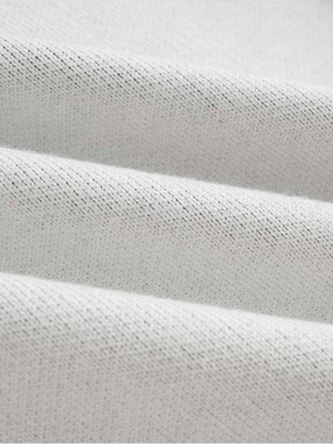 Zoomed-in texture of the TALISHKO cardigan, highlighting its soft, ribbed fabric.