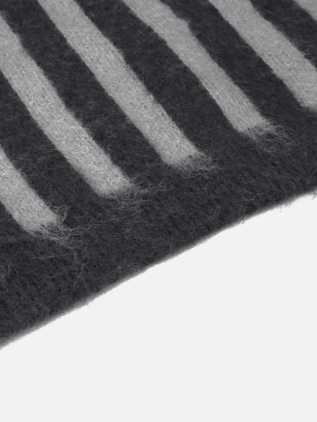 "Zoomed-in texture of the vintage striped sweater by TALISHKO, highlighting soft, cozy fabric."