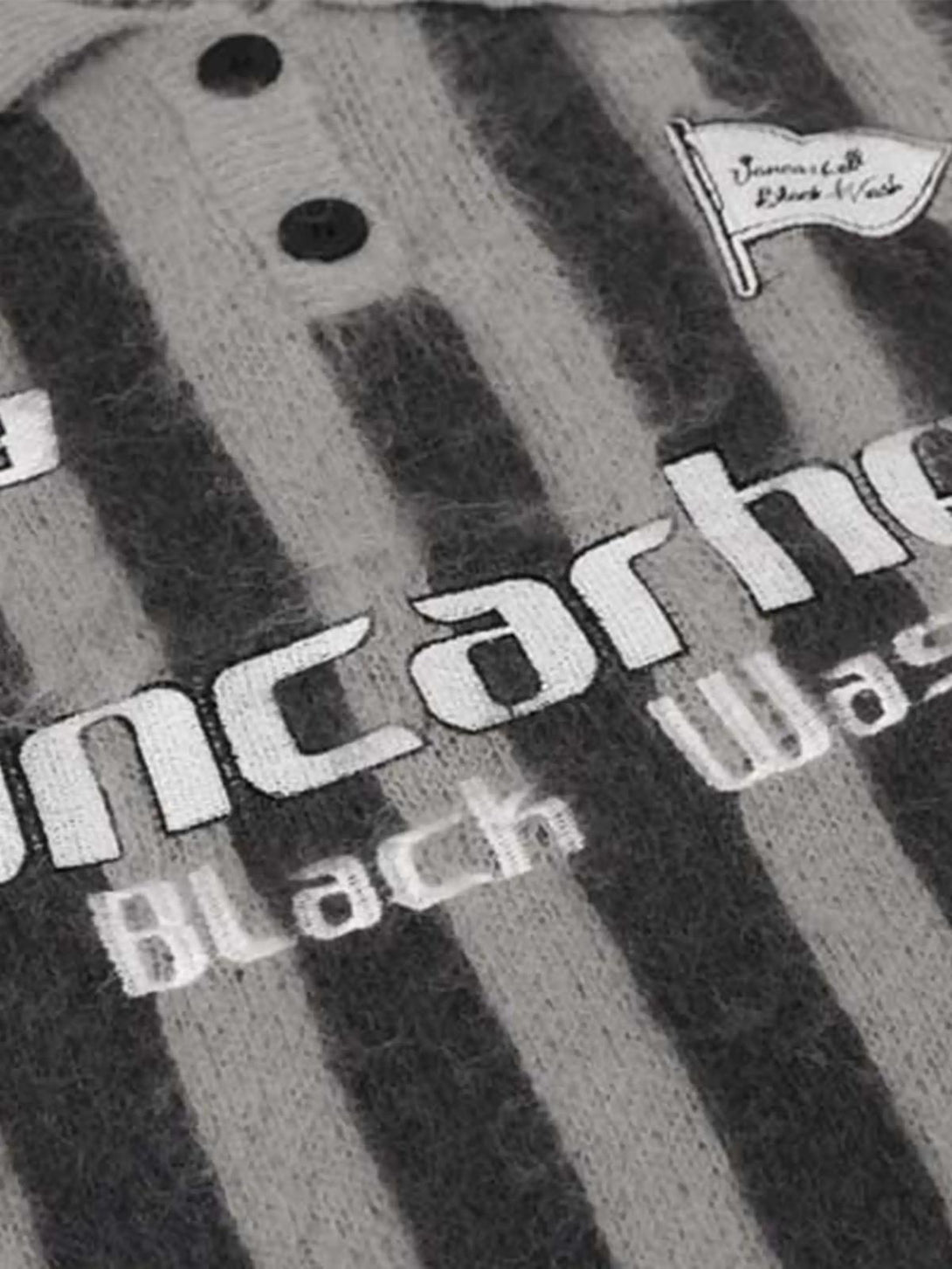 A detailed view of TALISHKO's vintage striped sweater, showcasing its soft, textured knit.