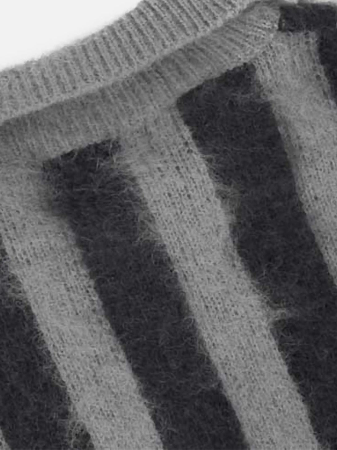 "Fuzzy texture of the vintage striped sweater by TALISHKO, highlighting its cozy knit fabric."
