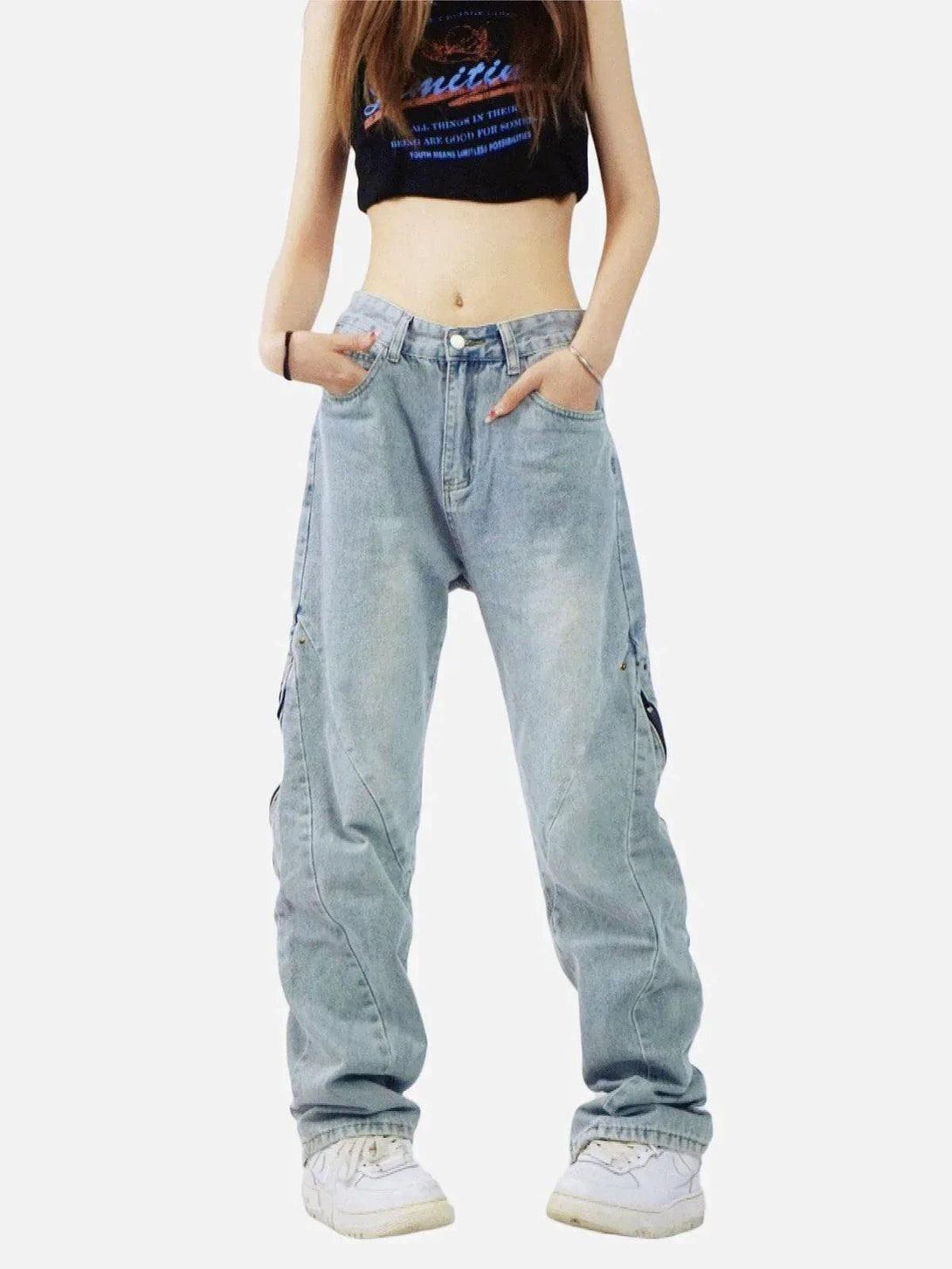 Model wearing vintage wash adjustable zip jeans by TALISHKO with casual style sneakers.