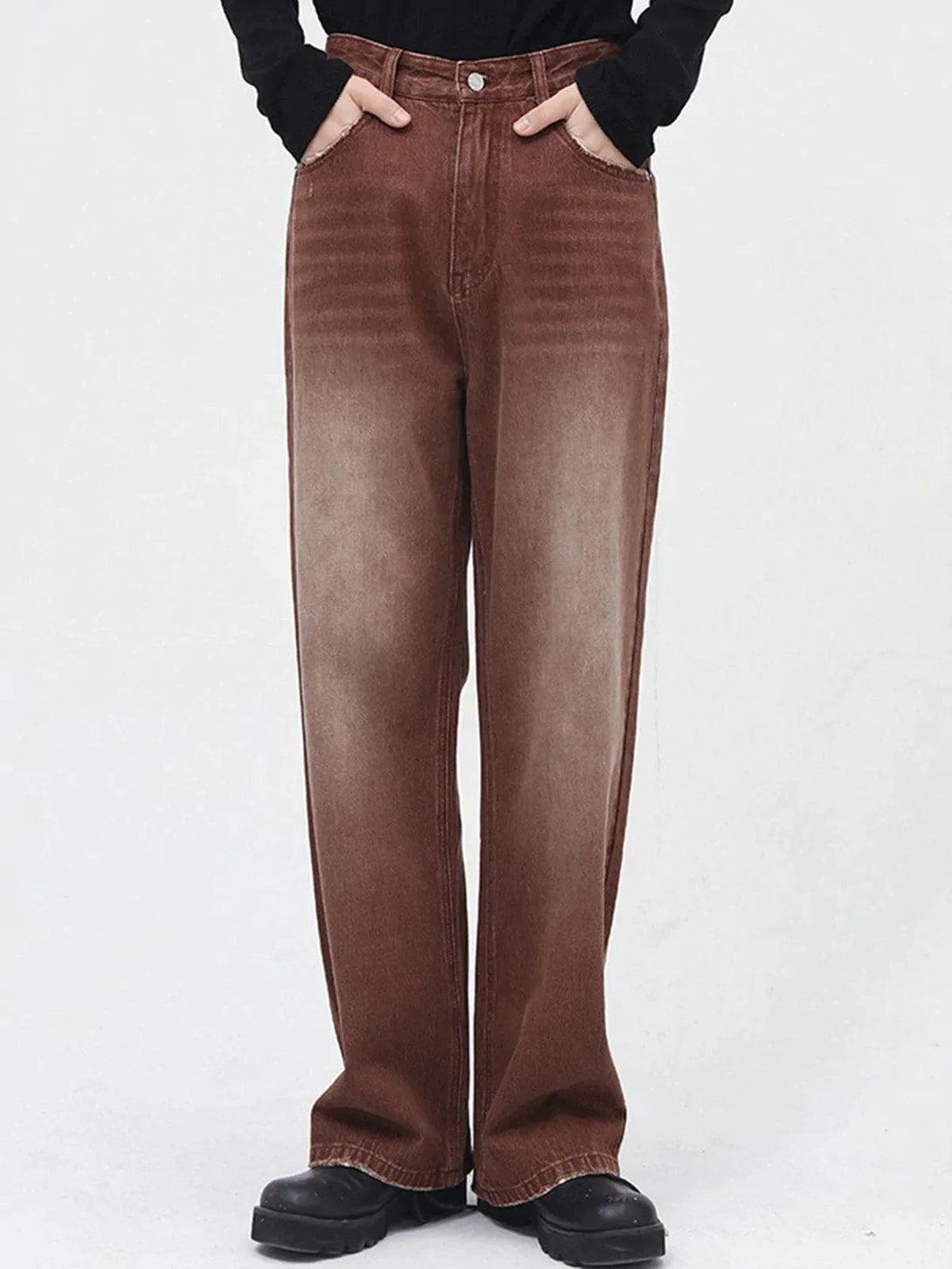 Model wearing vintage wash gradient jeans by TALISHKO, showcasing a relaxed fit style.