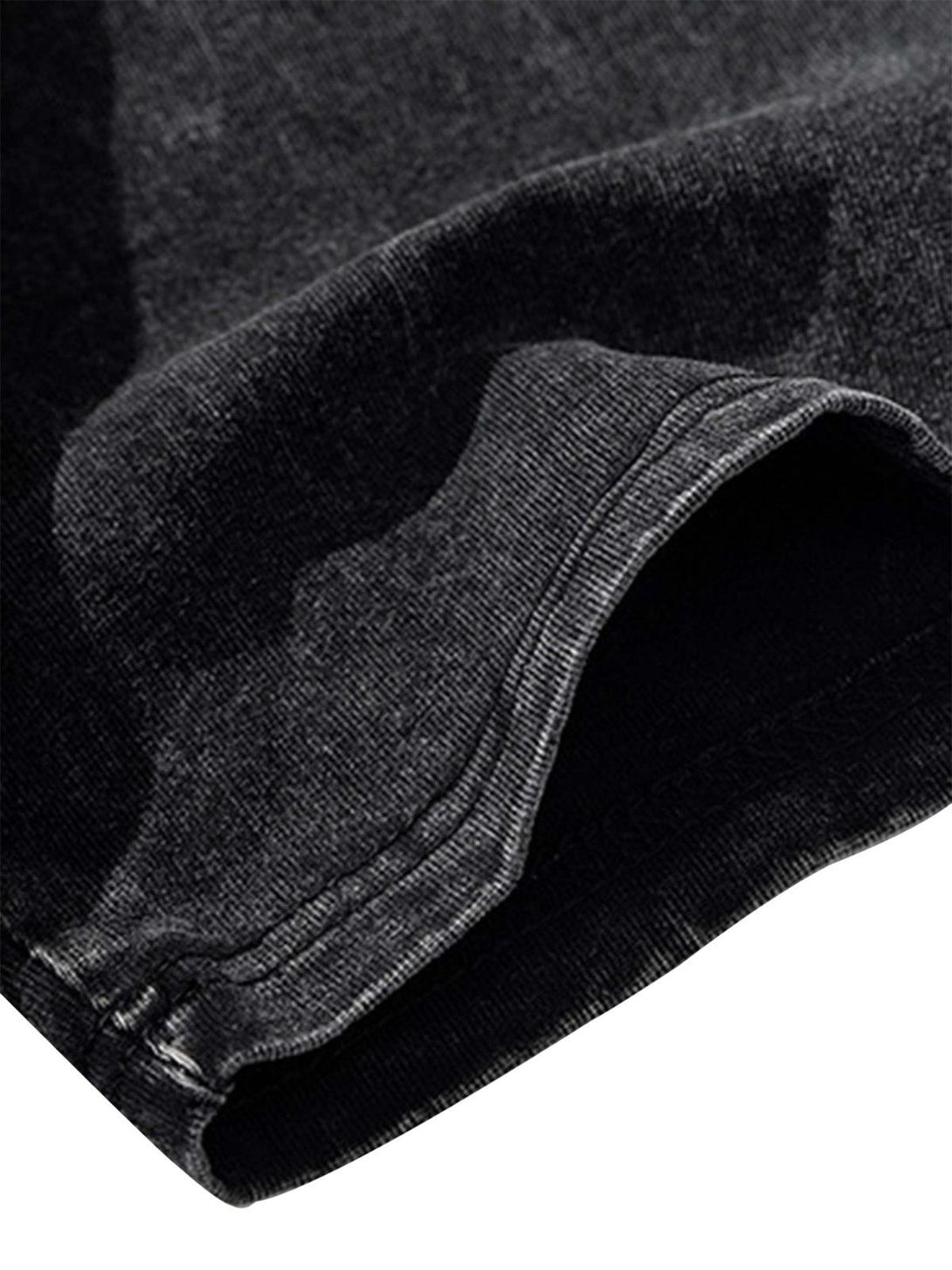 Detailed fabric and stitching of a vintage washed T-shirt by TALISHKO, showcasing its aged texture.