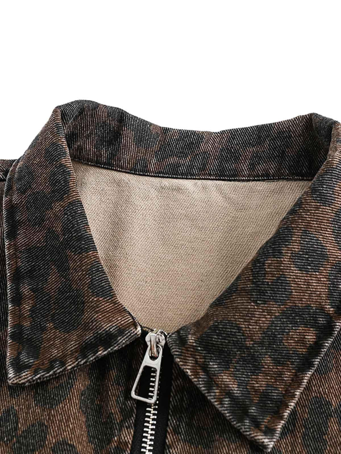 Detailed fabric and stitching on a vintage washed cheetah denim jacket by TALISHKO.