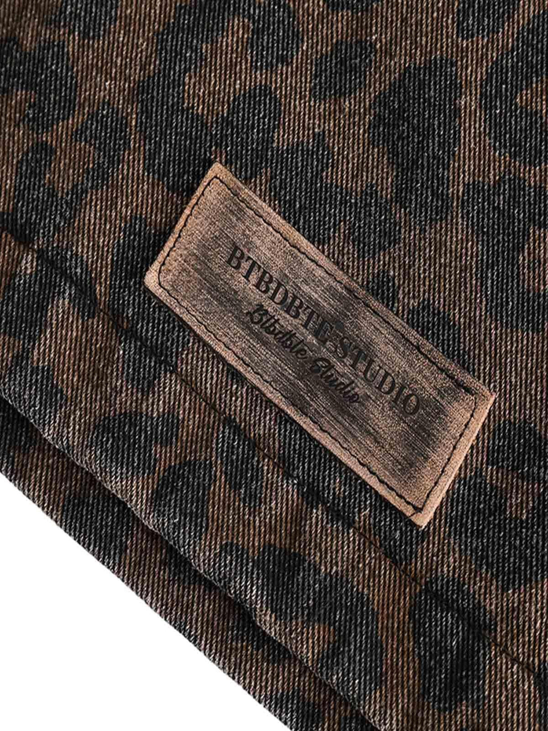 A detailed view of the cheetah pattern on a vintage washed denim jacket by TALISHKO.