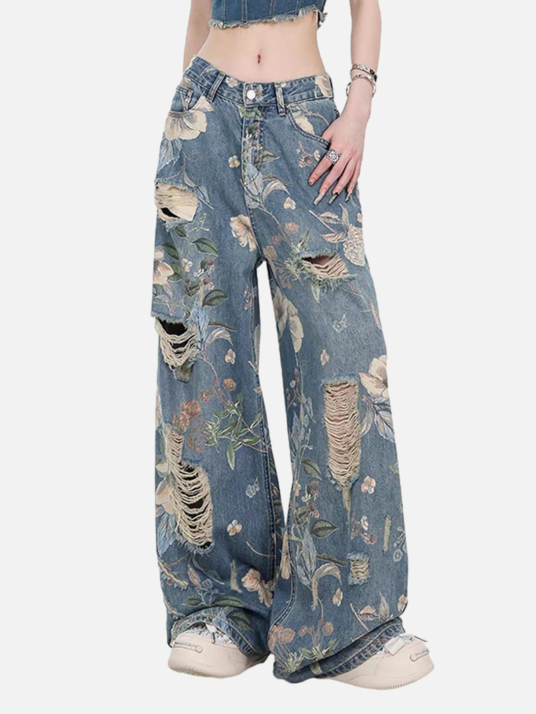 TALISHKO floral ripped baggy jeans with a vintage feel, worn by a model for casual styling.