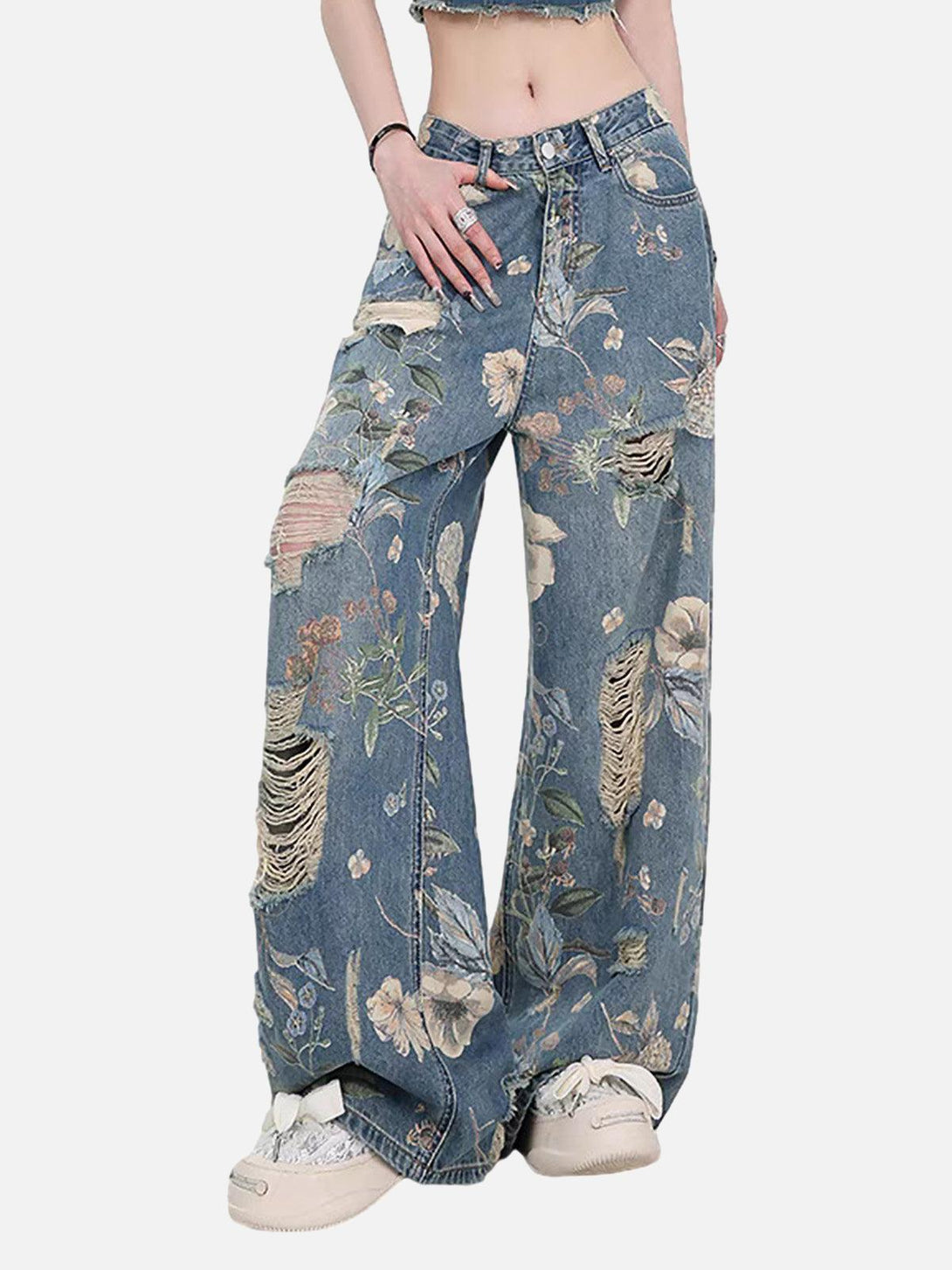 Model wearing TALISHKO vintage-inspired floral ripped baggy jeans with a distressed finish.