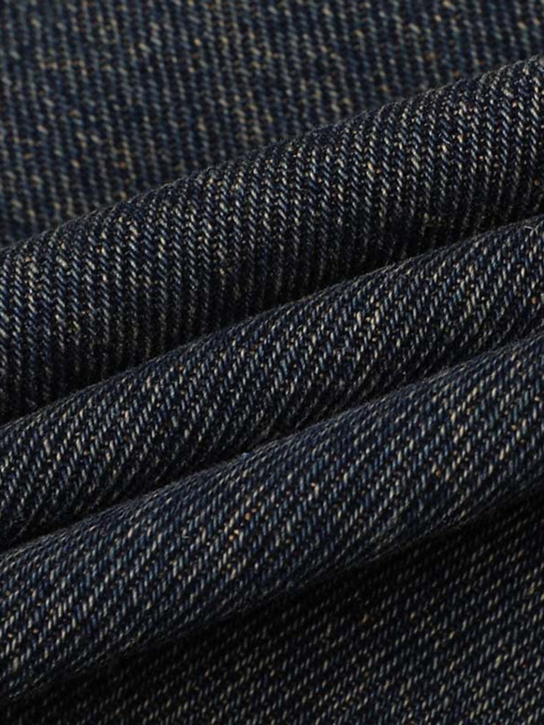 Zoomed-in texture of TALISHKO vintage washed cargo jeans, highlighting the rich denim weave.