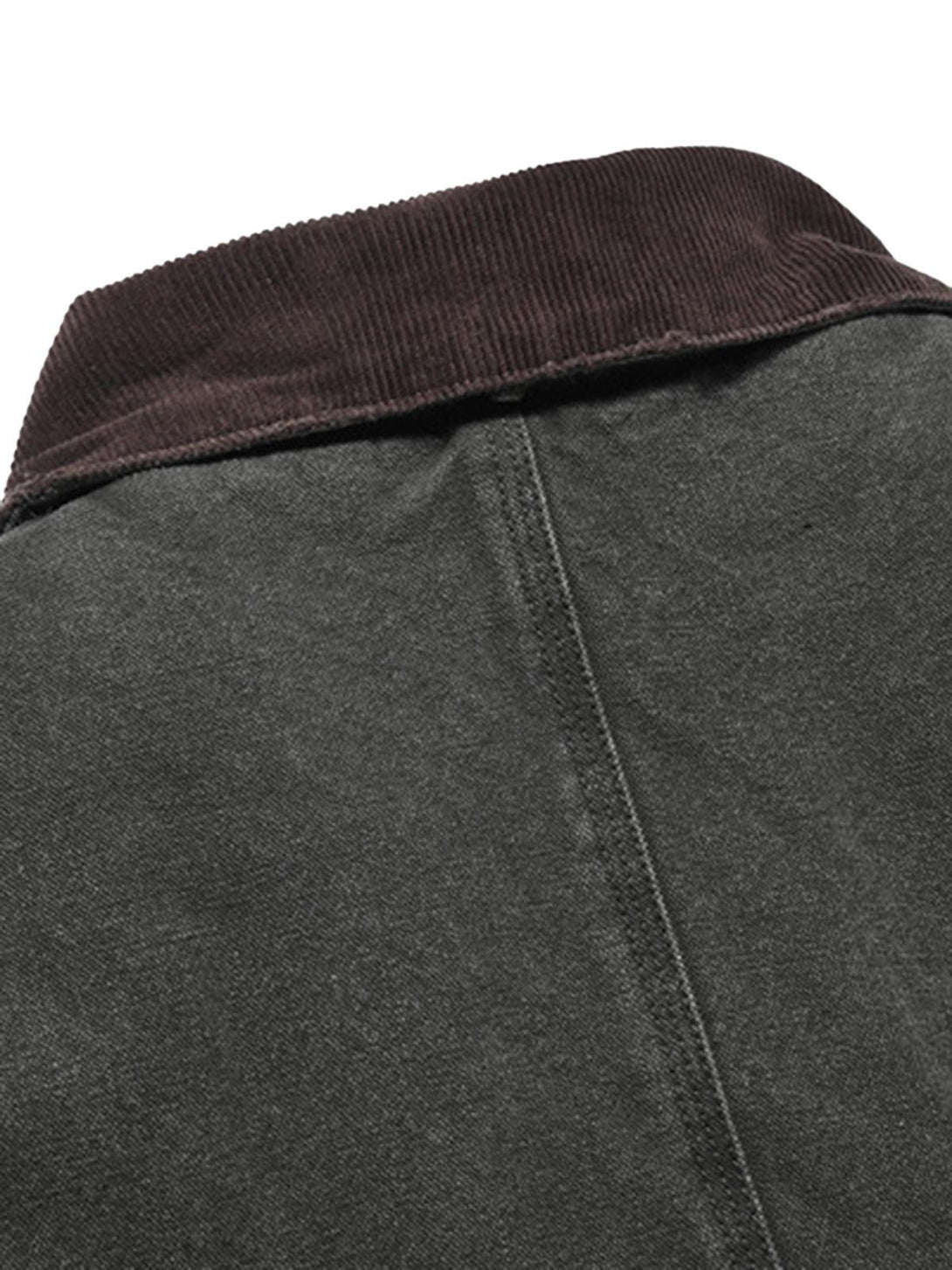 A detailed look at the collar of TALISHKO's quilted work jacket, highlighting vintage stitching.