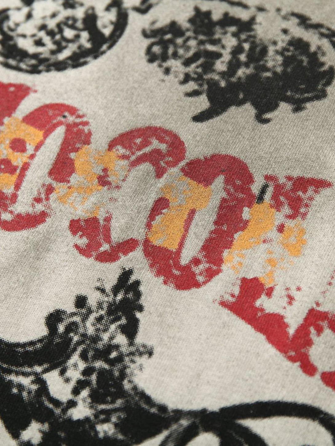 Zoomed-in texture of a vintage washed vest graphic by TALISHKO, emphasizing its distressed style.