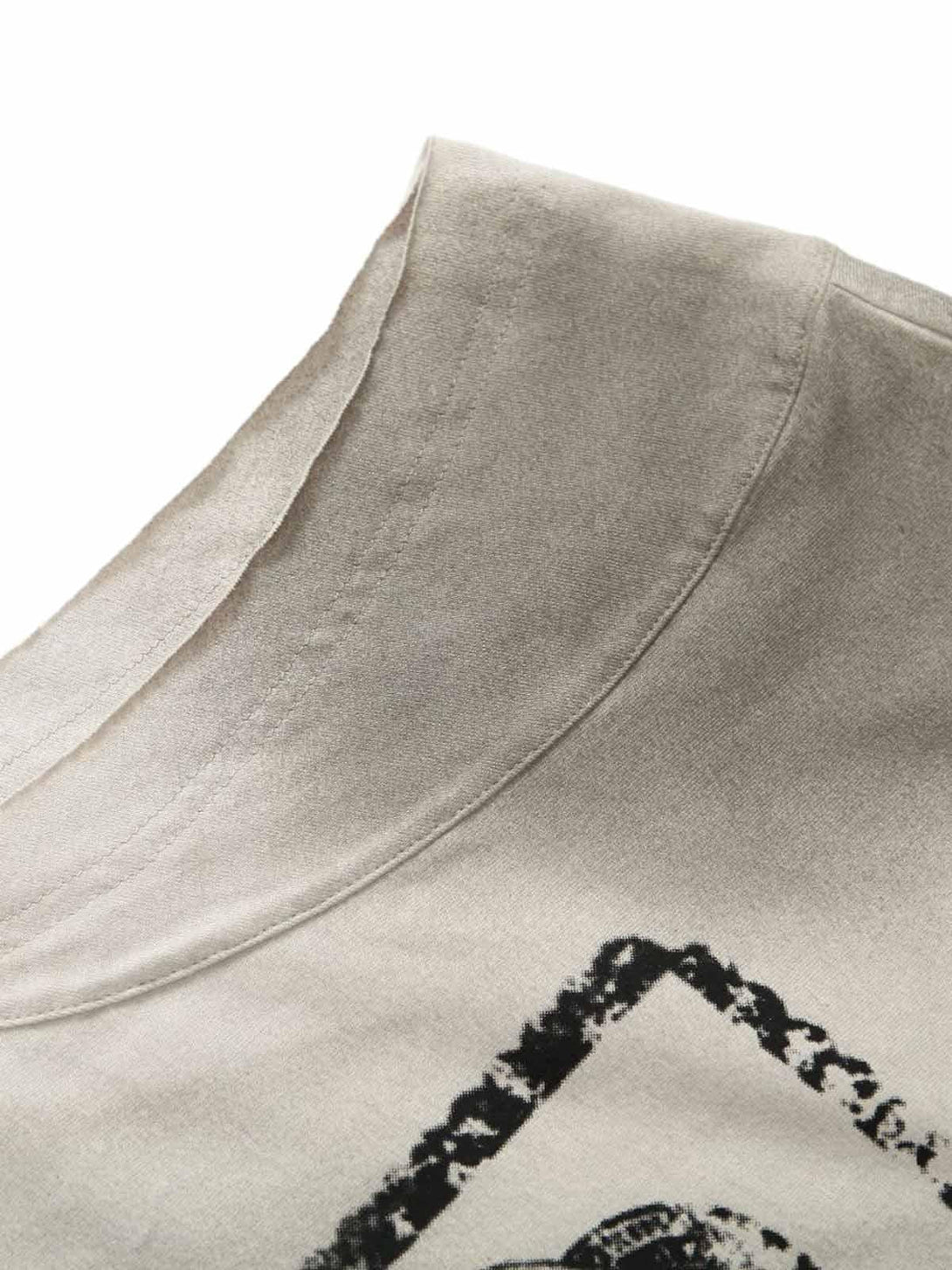A close-up of the neckline on a vintage washed vest by TALISHKO, showcasing its unique texture.