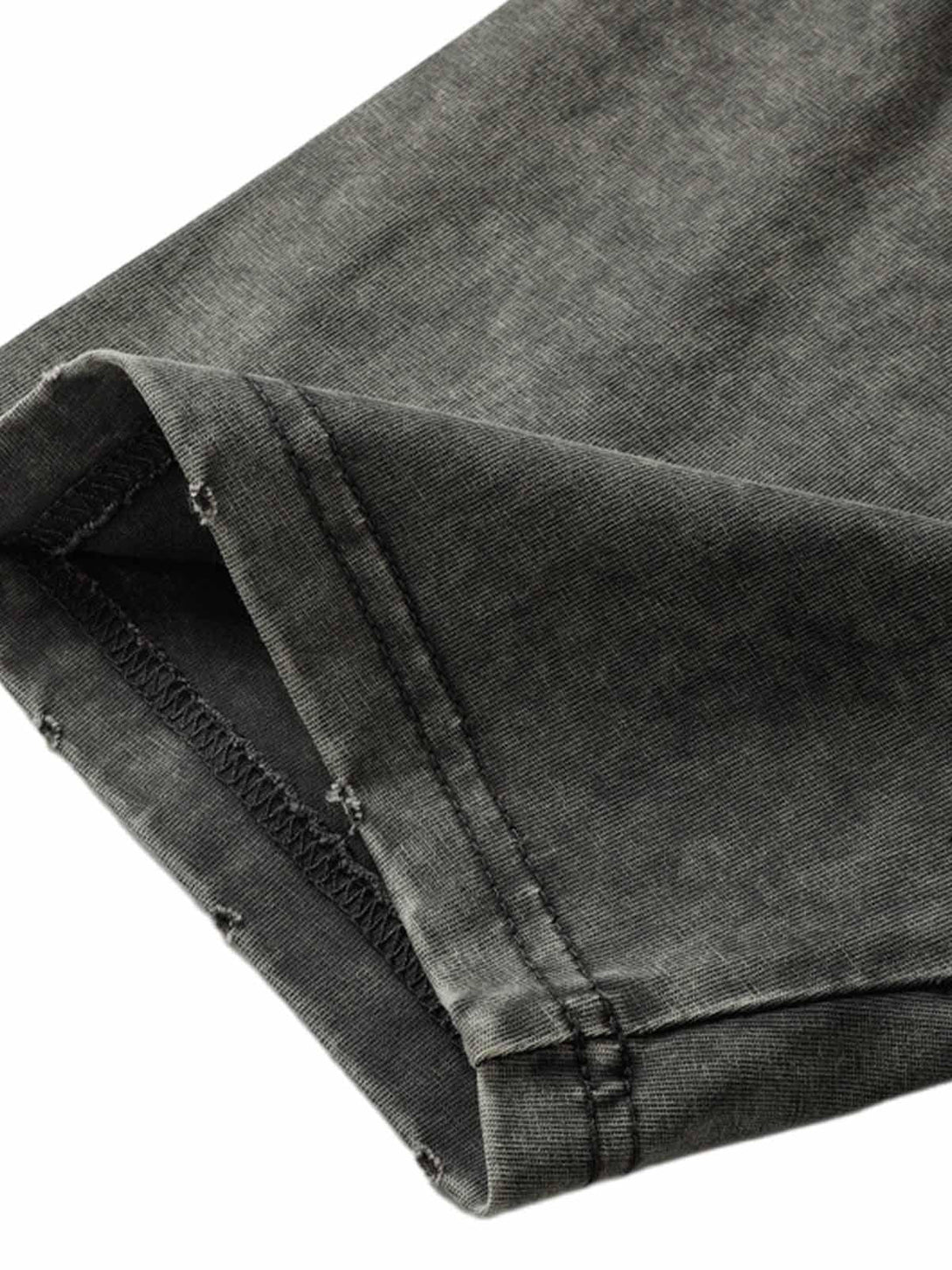 Detailed fabric and stitching of TALISHKO's vintage washed multi-pocket T-shirt.