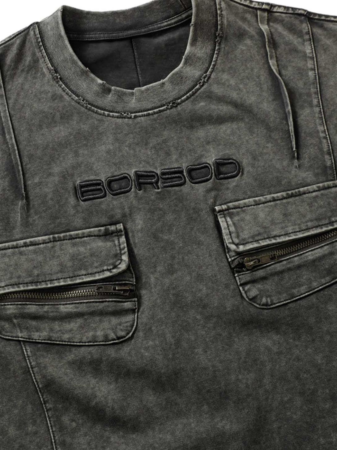 Intricate look at TALISHKO's vintage washed multi-pocket T-shirt, showcasing texture and design.