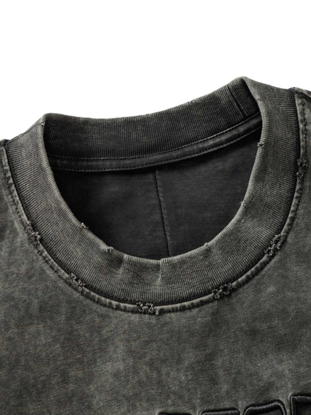 A detailed view of TALISHKO's vintage washed T-shirt, highlighting the neckline stitching.