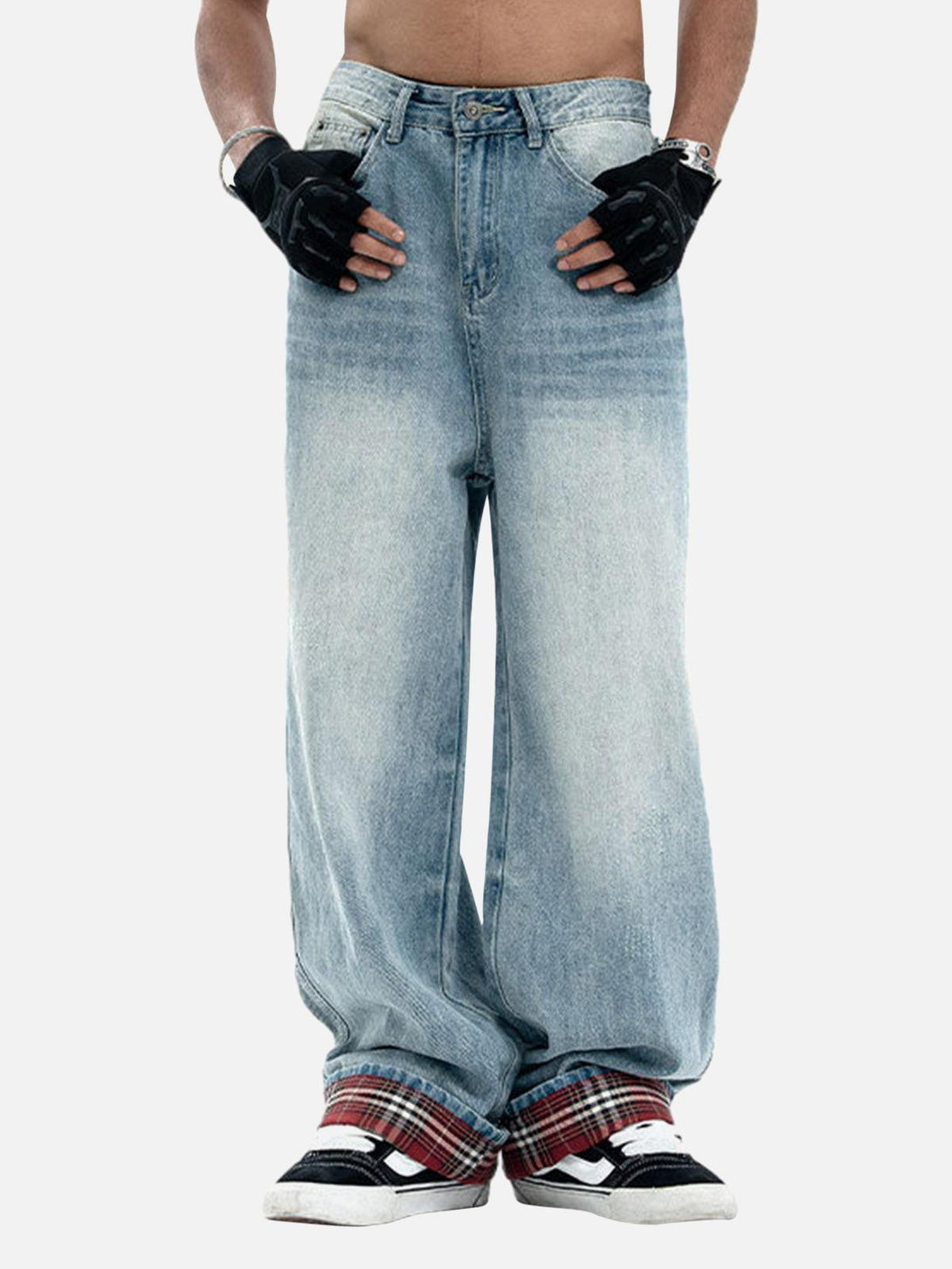 Model in TALISHKO vintage washed baggy jeans with plaid accents, highlighting a relaxed style.