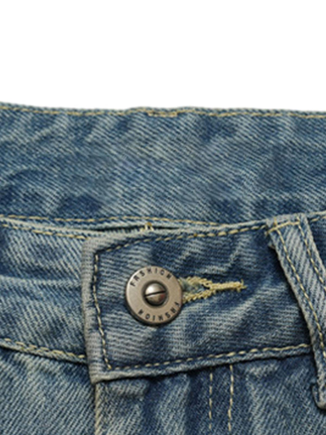 Detailed view of TALISHKO's denim button and stitching, highlighting vintage craftsmanship.