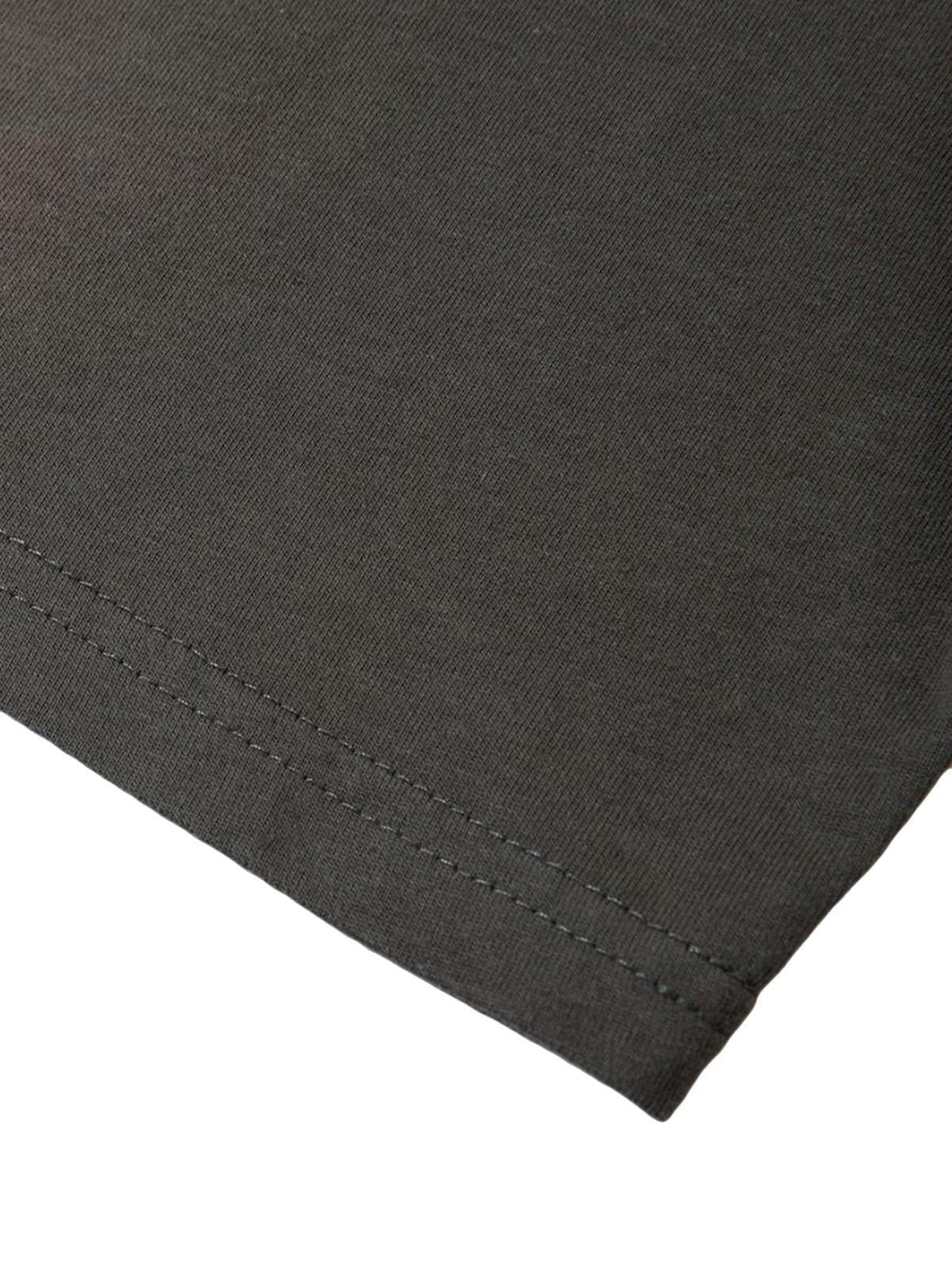 Detailed fabric and stitching of a vintage-inspired T-shirt by TALISHKO.