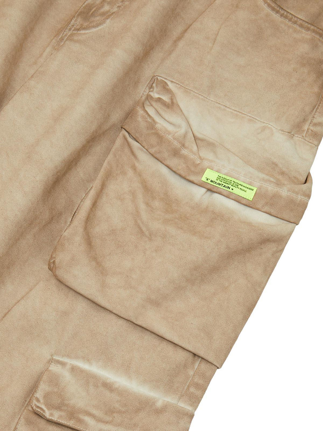 Zoomed-in view of TALISHKO's tan work pants, highlighting the multi-pocket detail.