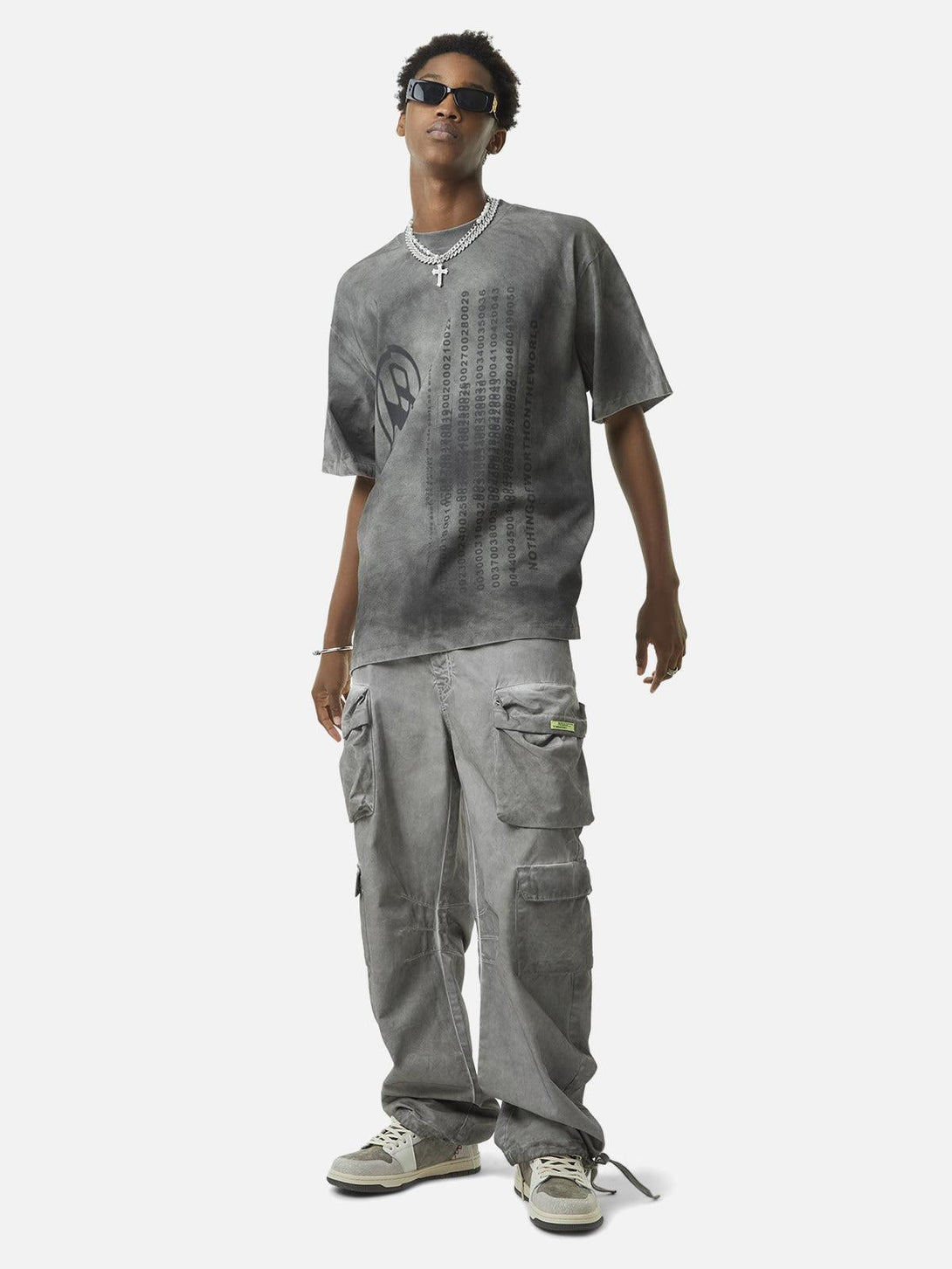 Model wearing TALISHKO vintage work pants and tee, capturing a laid-back urban style.