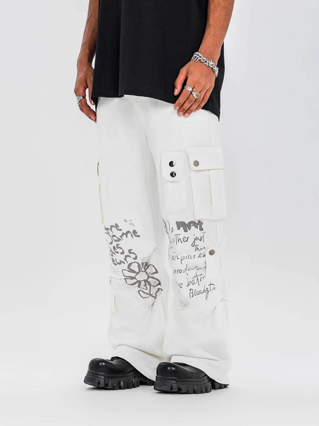 TALISHKO vintage cargo pants with artistic prints, worn by a model, adding bold urban flair.