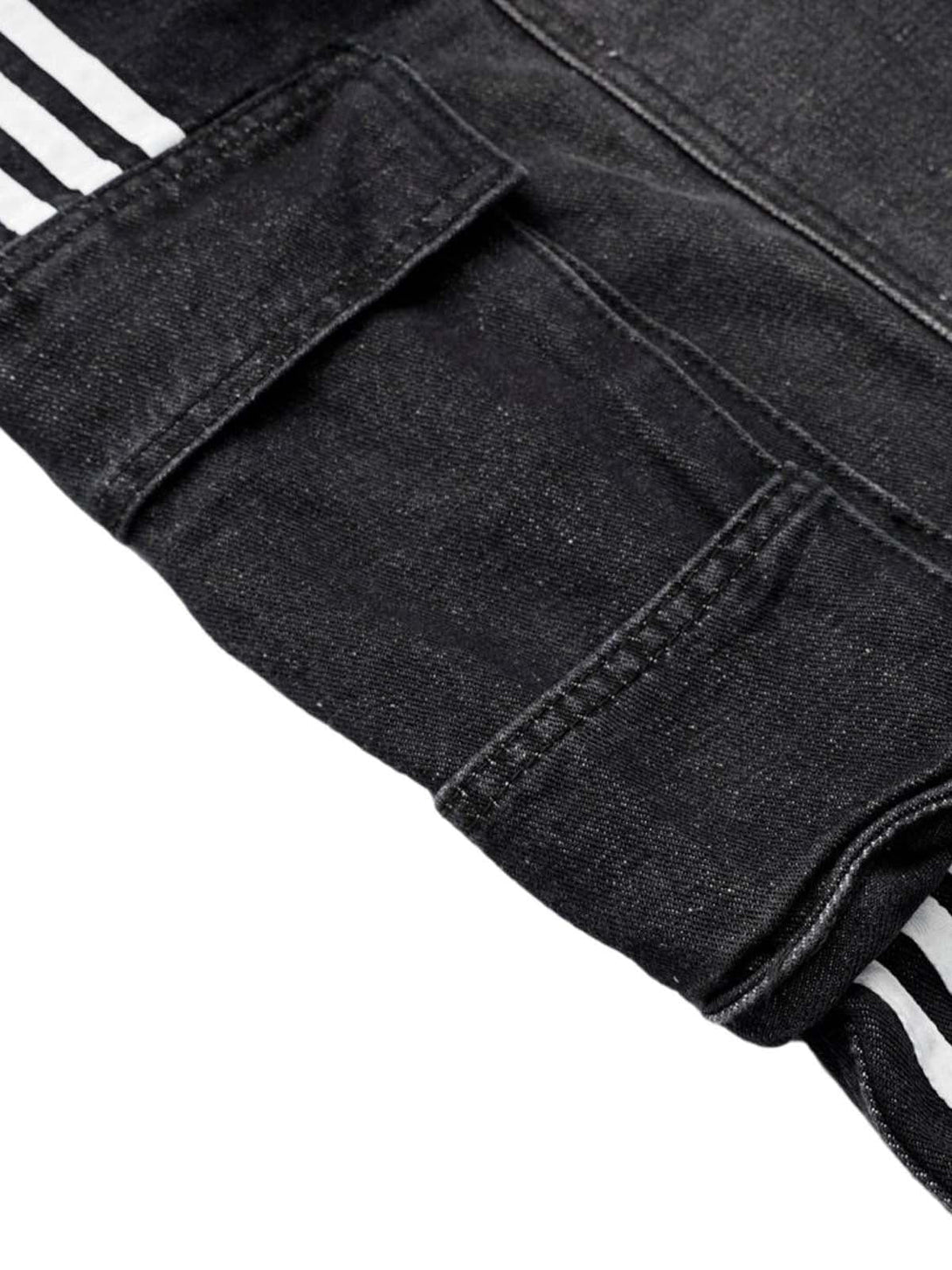 A detailed view of TALISHKO's washed cargo denim shorts, highlighting pocket design and stitching.