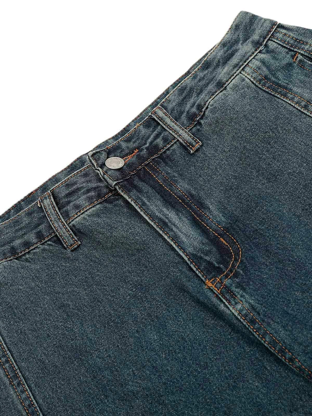 Detailed fabric and stitching of TALISHKO's washed baggy jeans, showcasing unique deconstruction.