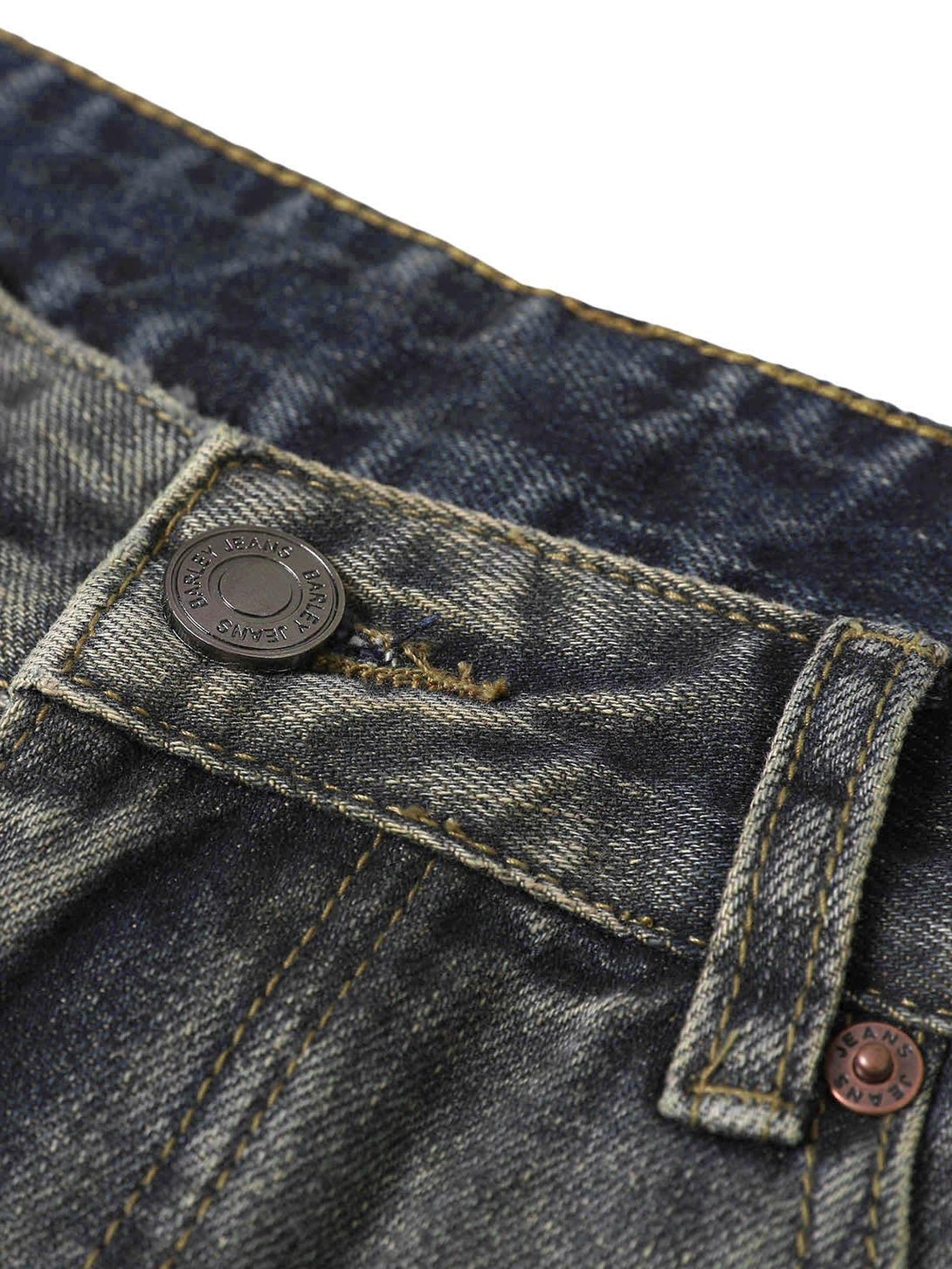 Zoomed-in texture of TALISHKO washed dirty-dye straight jeans, highlighting detailed stitching.