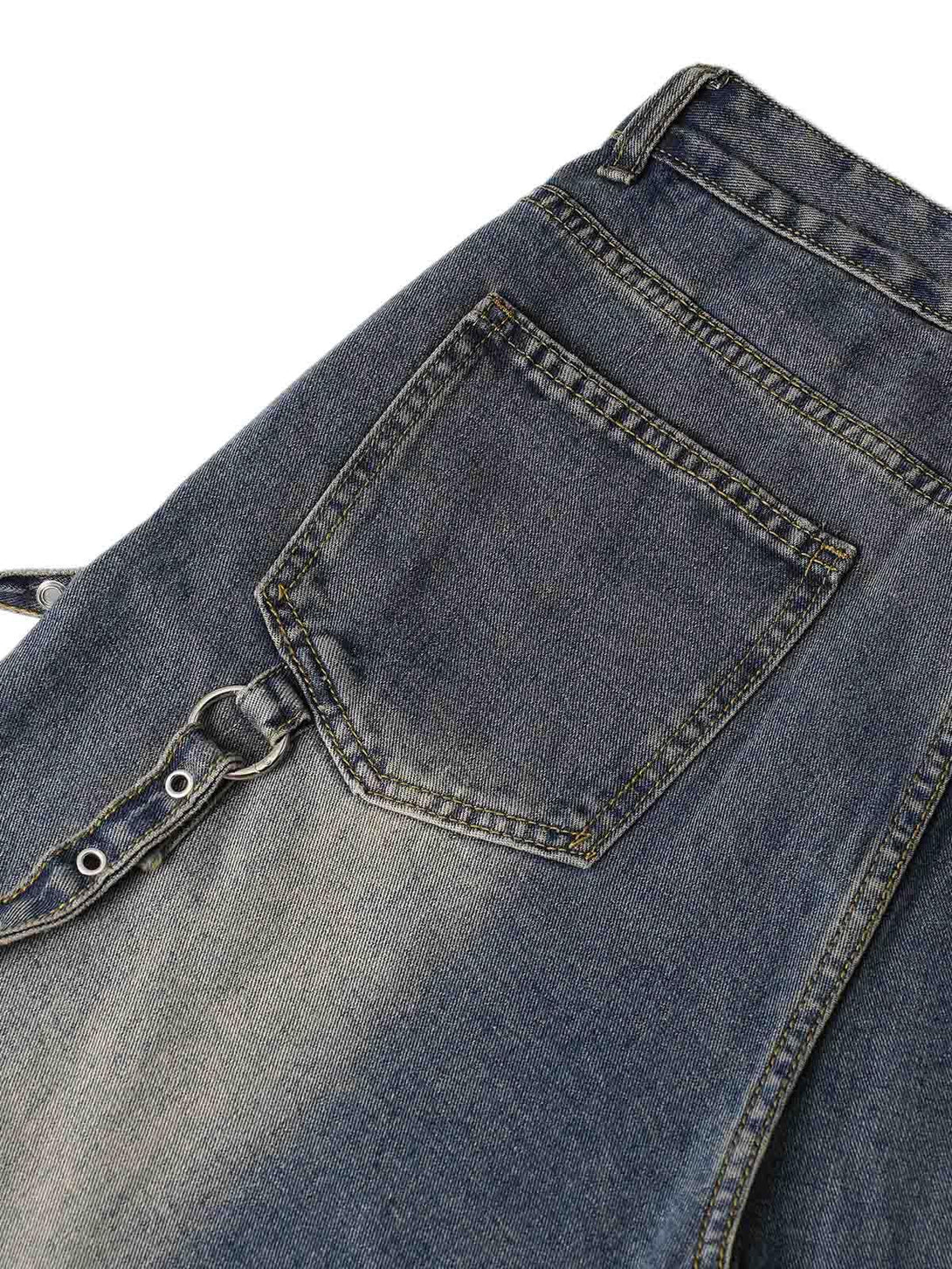 Close-up of washed distressed baggy jeans by TALISHKO, highlighting unique pocket detail.