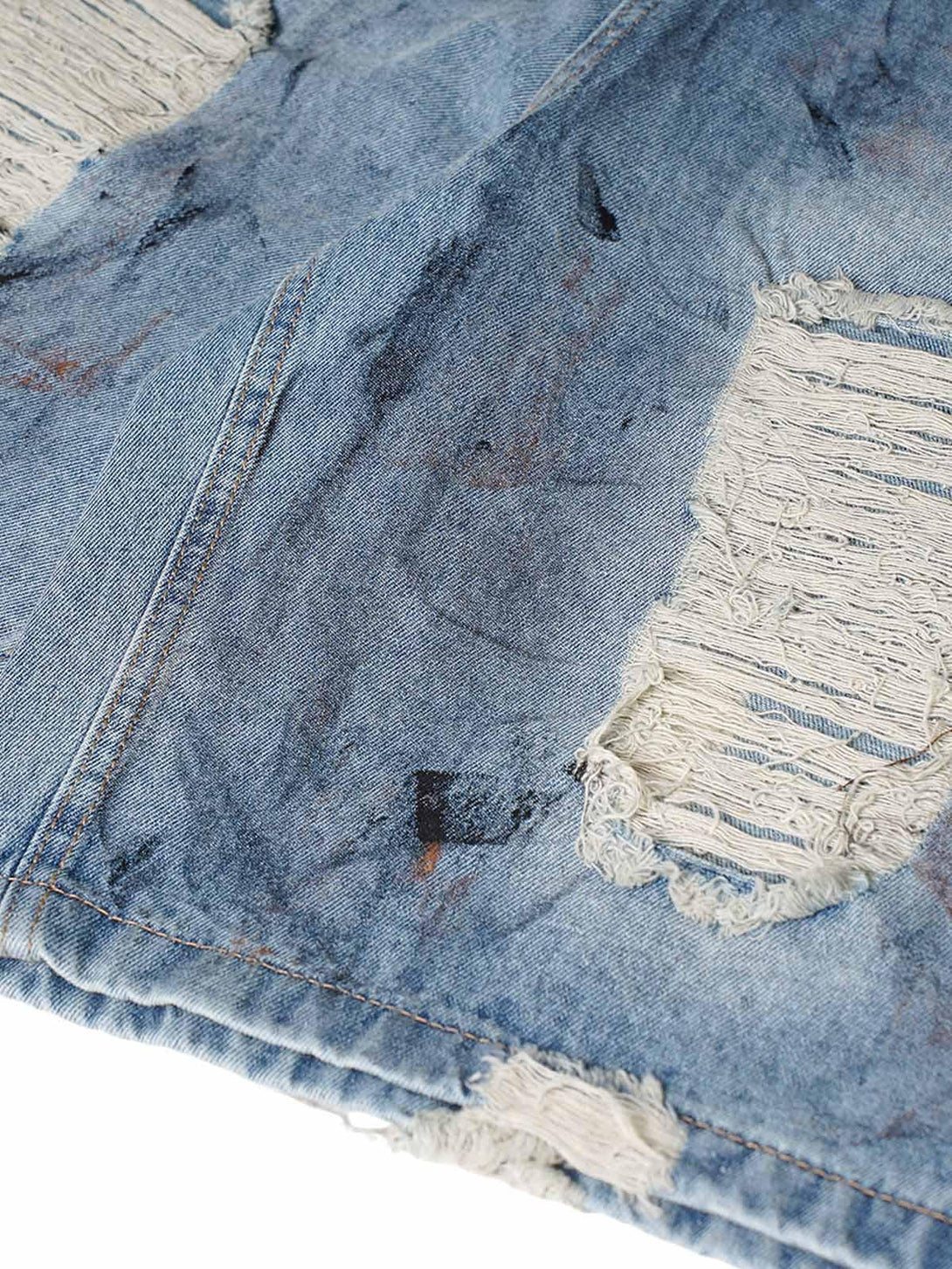 Texture and pattern showcased on TALISHKO denim shorts with distressed, dirty-dyed details.