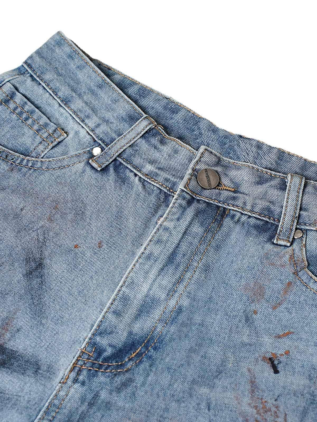 Intricate look at TALISHKO denim shorts showcasing distressed and dirty-dyed details.